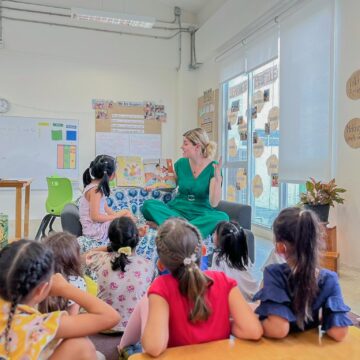 Students in classroom listening and looking at the teacher